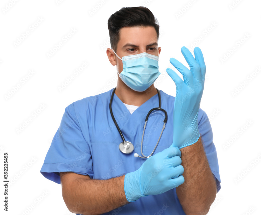 Doctor in protective mask putting on medical gloves against white background Doctor in protective mask putting on medical gloves against white background