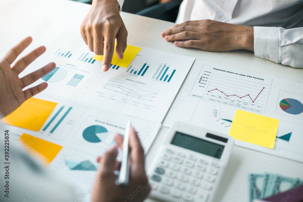 A group of professional business people sit on a meeting table in the office to discuss banking issues. Share partner A meeting idea that talks about a graph A group of professional business people sit on a meeting table in the office to discuss banking issues. Share partner A meeting idea that talks about a graph