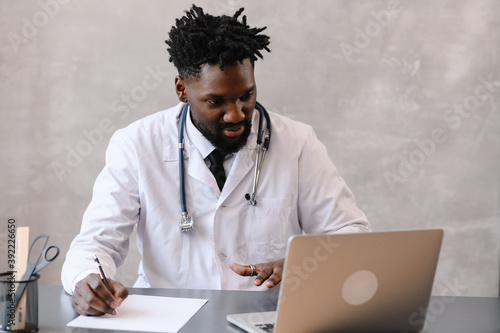 Black doctor. Telemedicine the use of computer and telecommunications technologies for the exchange of medical information