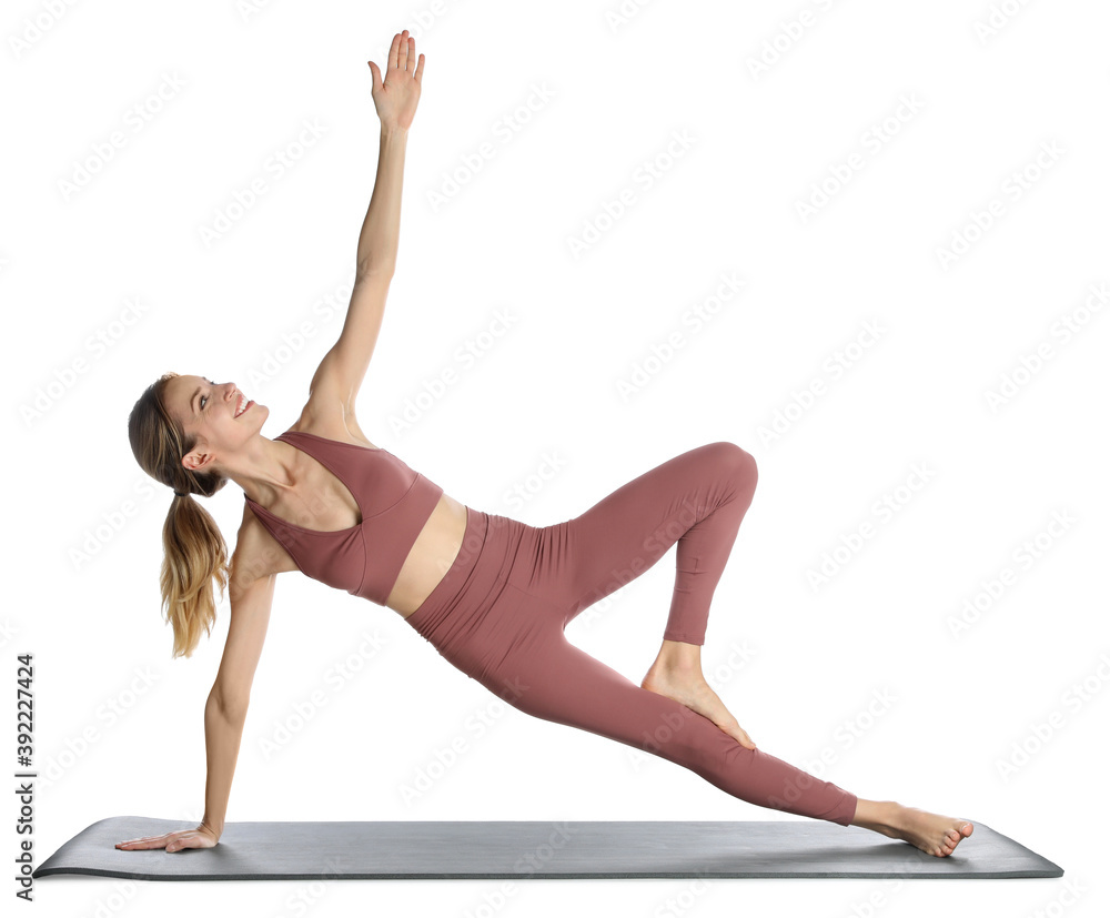 Young woman in sportswear practicing yoga on white background Young woman in sportswear practicing yoga on white background