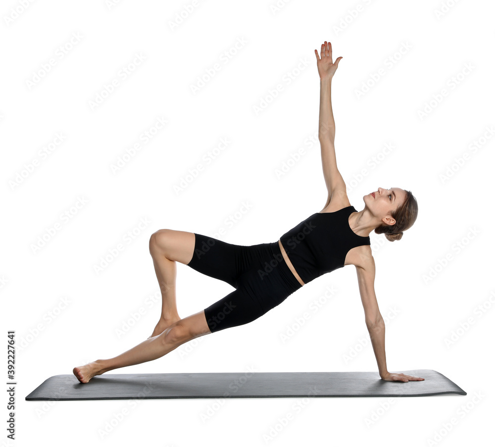 Young woman in sportswear practicing yoga on white background Young woman in sportswear practicing yoga on white background