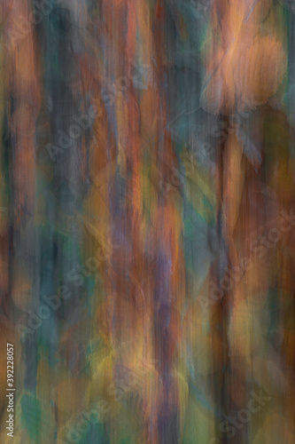 Abstract image of autumn hornbeam bush using intentional camera movement to create impressionist art style photograph.