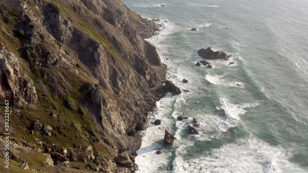 Flying over rocks on the ocean