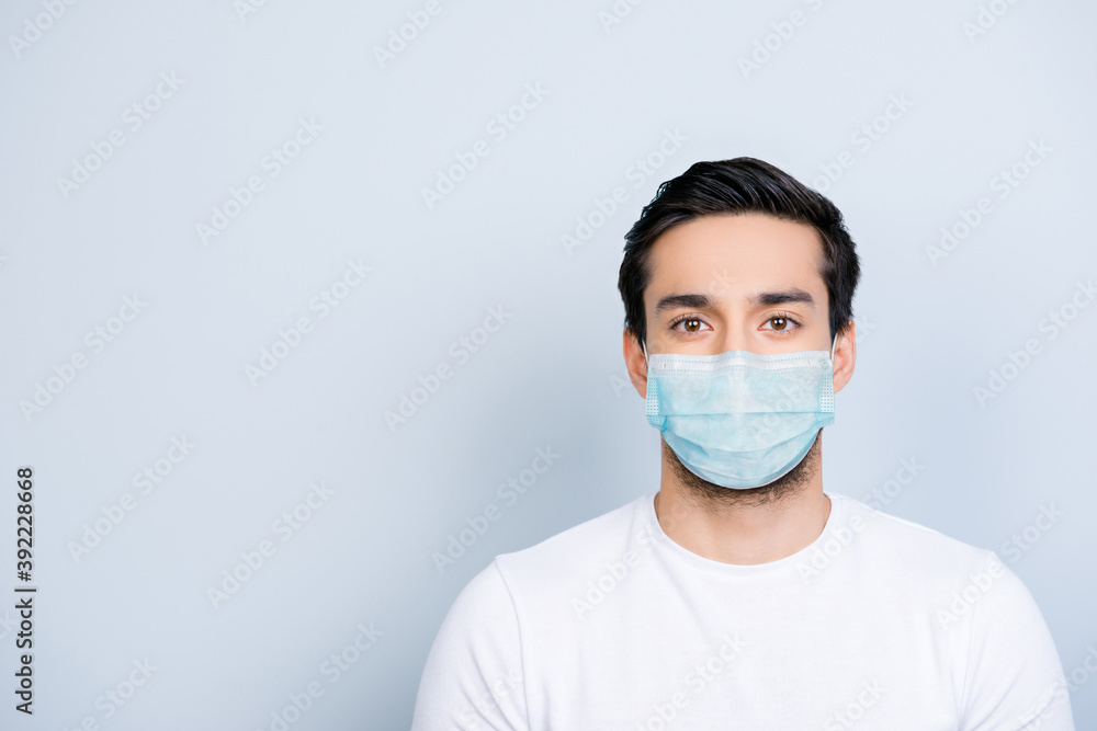Portrait of man wearing blue face mask isolated on white colored background with blank space