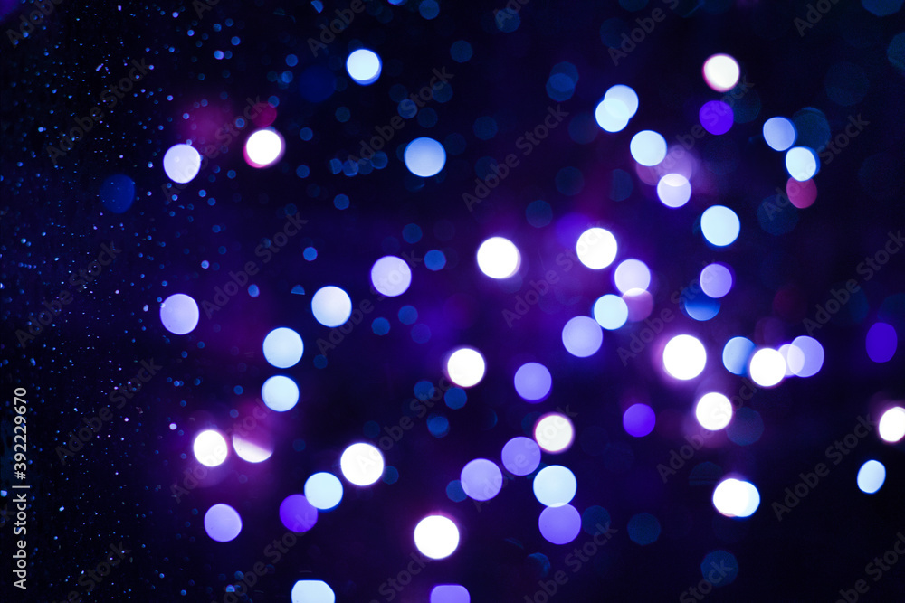 Festive new year and Christmas background with blue bokeh lights. The concept of holidays - New year and birthday. Festive new year and Christmas background with blue bokeh lights. The concept of holidays - New year and birthday.