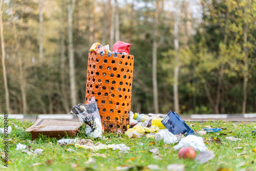Overflowing Waste Bin in a Tourist Parking Lot