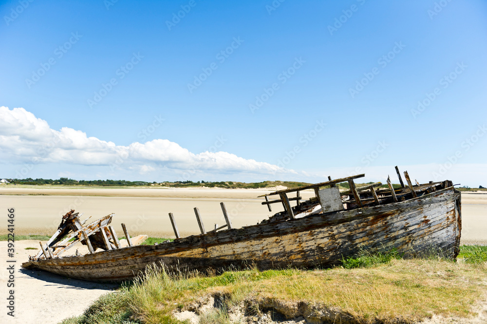 Wrecked boat on the beach, Portbail / Port-bail, Manche, Normandy France Wrecked boat on the beach, Portbail / Port-bail, Manche, Normandy France