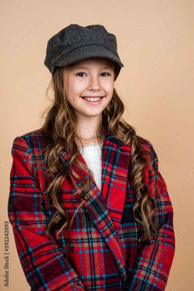 Hip and stylish. beauty and fashion. cheerful parisian child has long hairstyle. stylish kid wear trendy french cap. seasonal autumn fashion look. teenage girl in checkered jacket. happy childhood Hip and stylish. beauty and fashion. cheerful parisian child has long hairstyle. stylish kid wear trendy french cap. seasonal autumn fashion look. teenage girl in checkered jacket. happy childhood