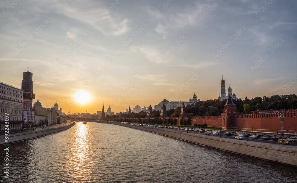 Beautiful evening view of the Moscow river and the architectural complex of the Moscow Kremlin.