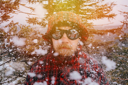 Fototapeta Naklejka Na Ścianę i Meble -  Portrait of a male traveler in the winter forest