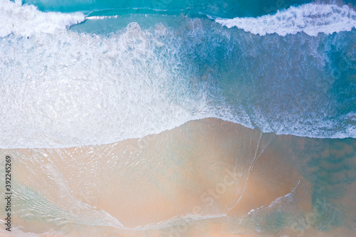 (Top view) Beach seawater wave on sandy beach. Background and travel concept.