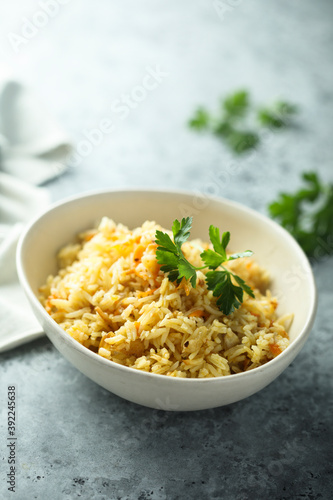 Homemade spicy rice with carrot and parsley