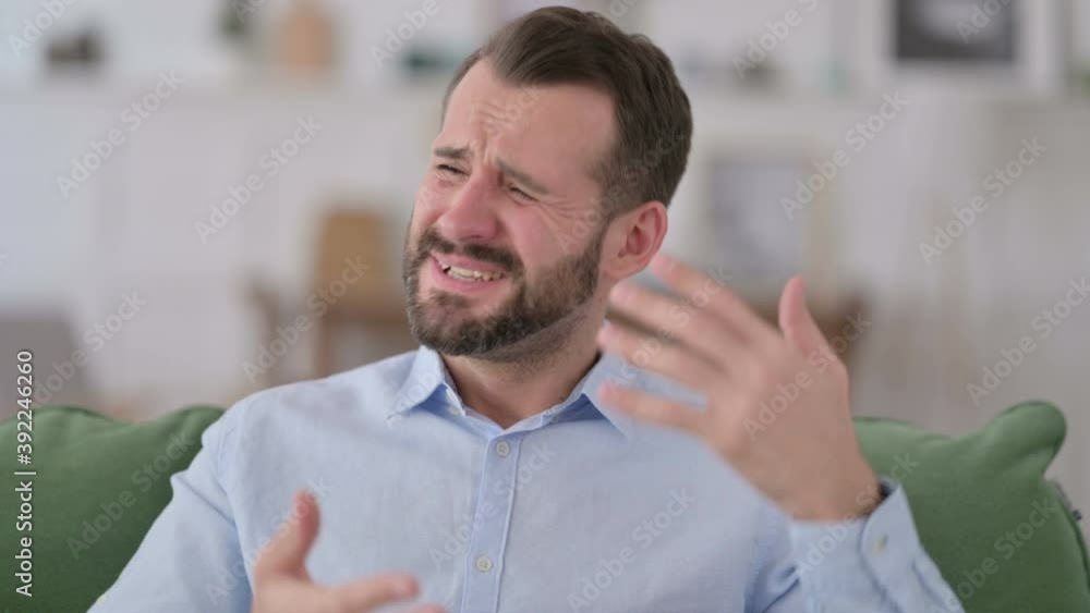 Young Man having Loss at Home Young Man having Loss at Home
