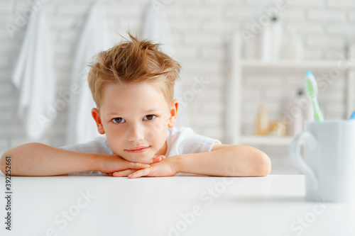 Little boy portrait standing in a bathroom