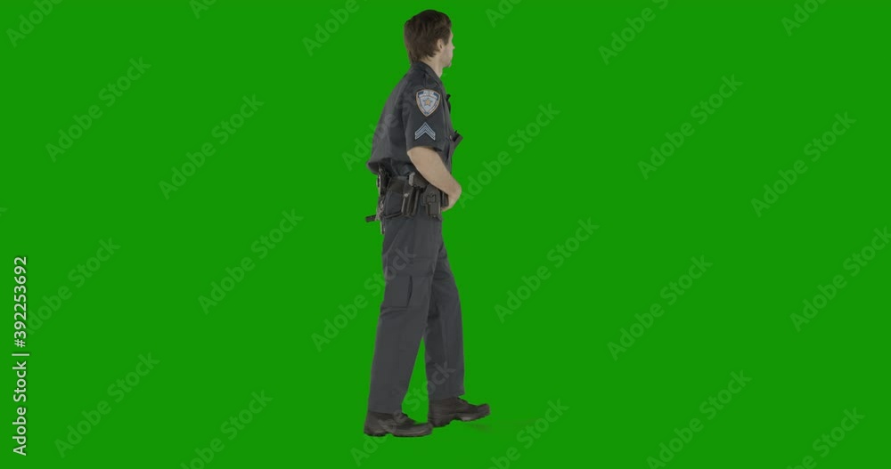 CHROMA KEY Caucasian male police officer walking against green screen. Model and property released for commercial use CHROMA KEY Caucasian male police officer walking against green screen. Model and property released for commercial use