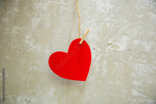 red heart on wooden background