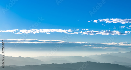 Landscape images of The morning time, where a beautiful light covers the mountain range, And the light reflected on the clouds in the sky, to nature background concept.