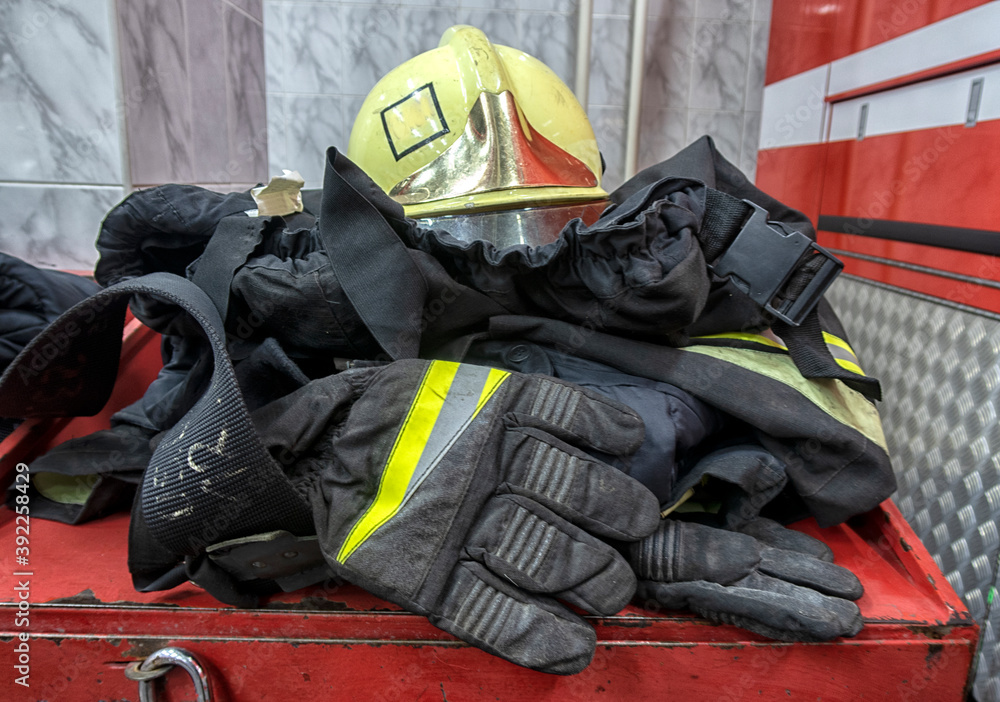 close-up of uniforms for firefighters lies on the table close-up of uniforms for firefighters lies on the table