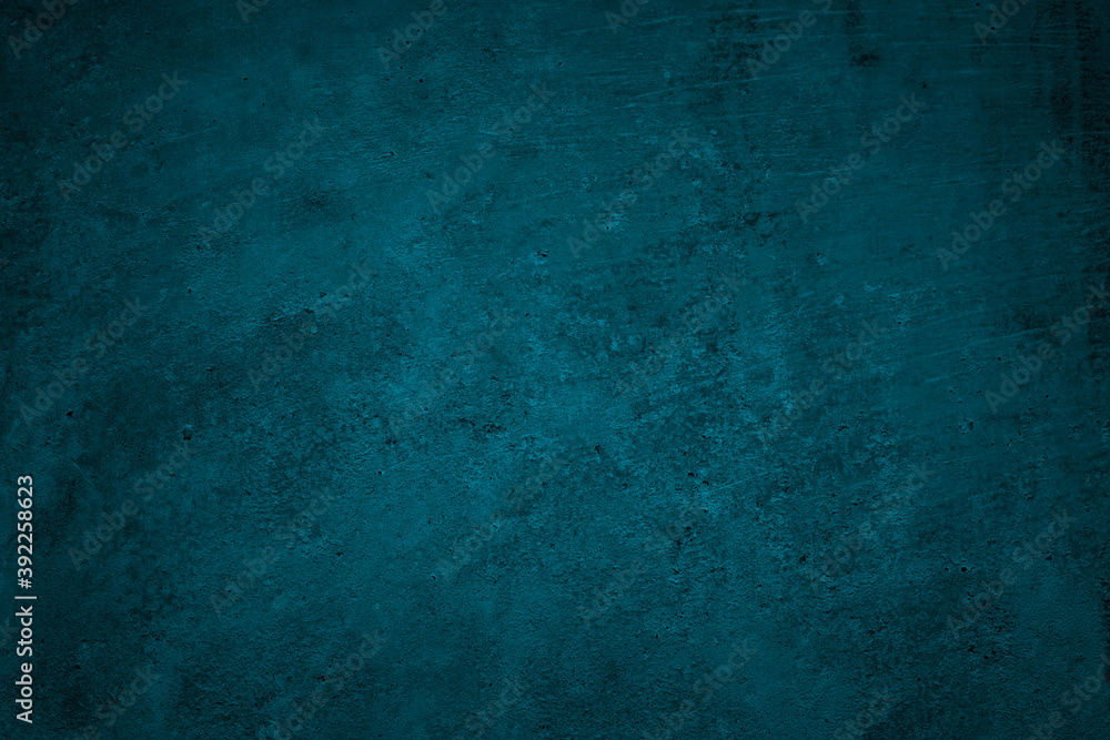 Blue green grunge background. Dark abstract rough background. Toned concrete wall texture. Combination of teal color and grunge texture.