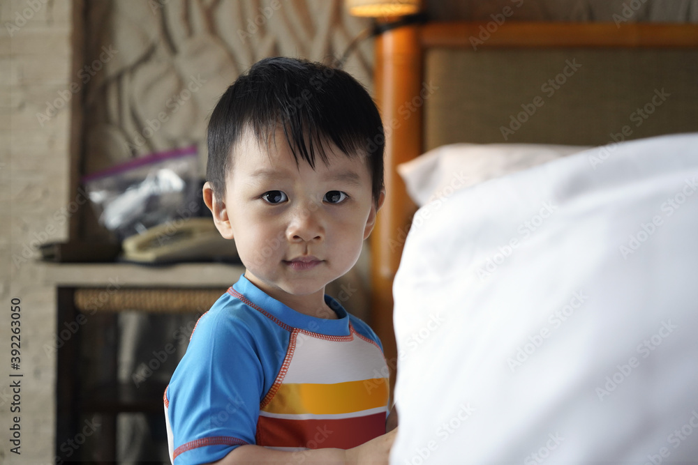 Portrait of a little cute baby two years old wear colorful shirt is looking at the camera with thinking idea space on the right side. Portrait of a little cute baby two years old wear colorful shirt is looking at the camera with thinking idea space on the right side.
