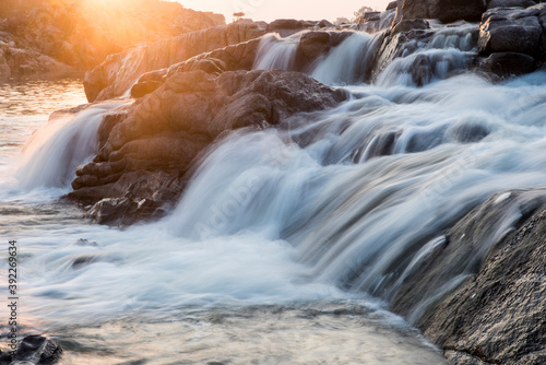 waterfall in the mountains at evening