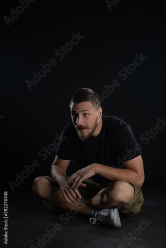 Funny guy posing on black background. Isolated © Bogdan