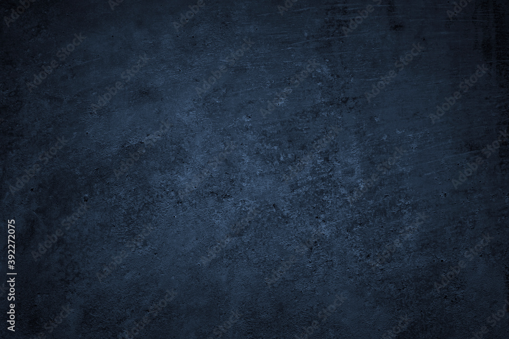 Dark grunge background. Black blue abstract rough background. Toned concrete wall texture.