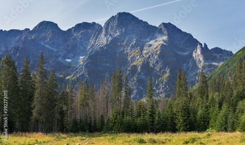 Fototapeta Naklejka Na Ścianę i Meble -  Landscapes with a tourist on a background of mountains and lakes with evening lighting