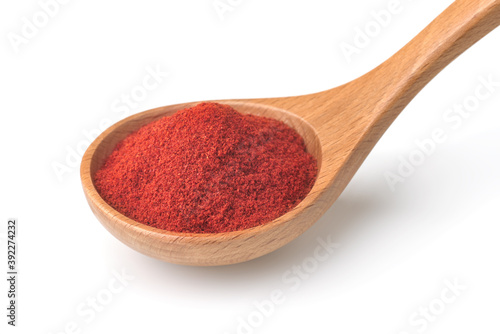 Fotobehang Red paprika powder in wooden spoon