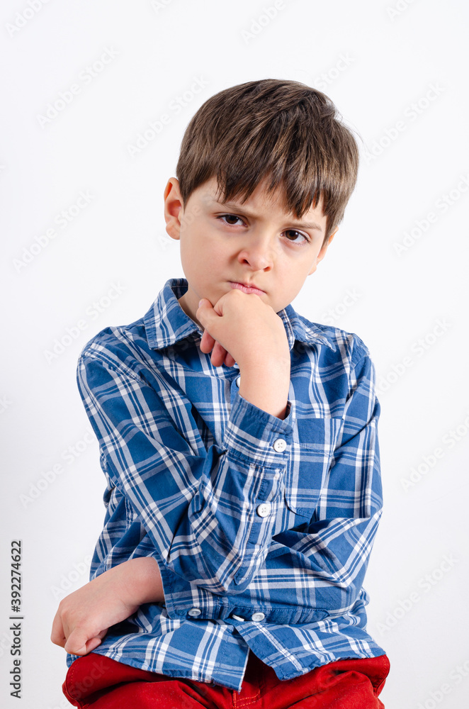 Cute boy leaning chin on hand and posing Cute boy leaning chin on hand and posing