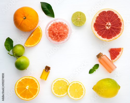 Top view of citrus fruits on white wooden background. Ingredient of punch and cocktail drink. Mix fresh citrus fruits Lemon, orange lime,mandarin,grapefruit. in fresh and colourful fruits concept. 