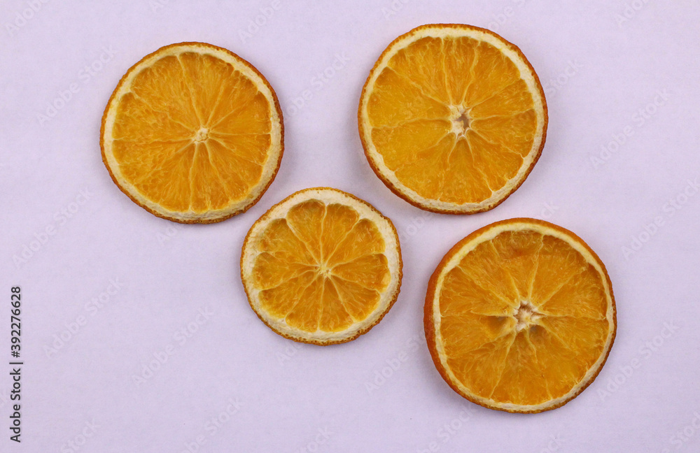 White background with dried sliced oranges White background with dried sliced oranges