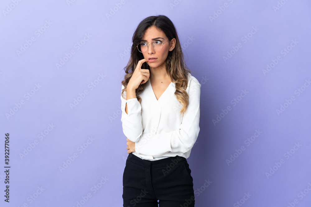 Young caucasian woman isolated on purple background nervous and scared Young caucasian woman isolated on purple background nervous and scared