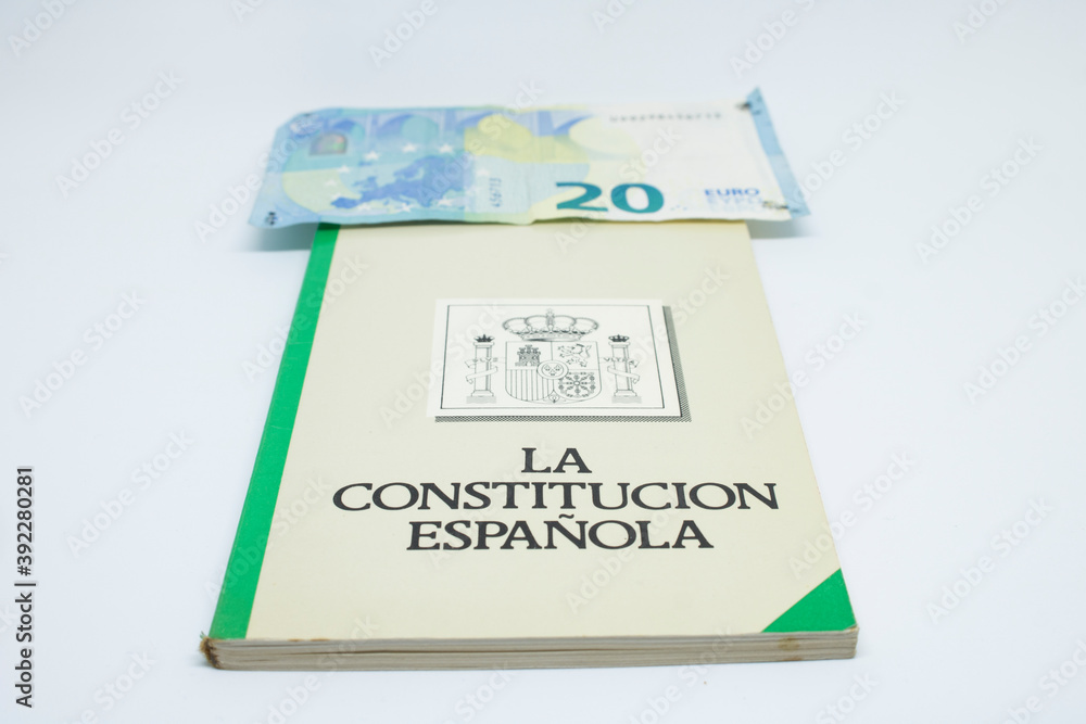 Euro banknotes with the Spanish constitution and white background Euro banknotes with the Spanish constitution and white background