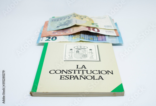 Euro banknotes with the Spanish constitution and white background