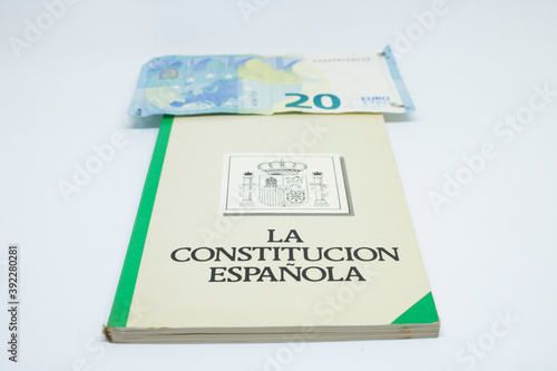 Euro banknotes with the Spanish constitution and white background