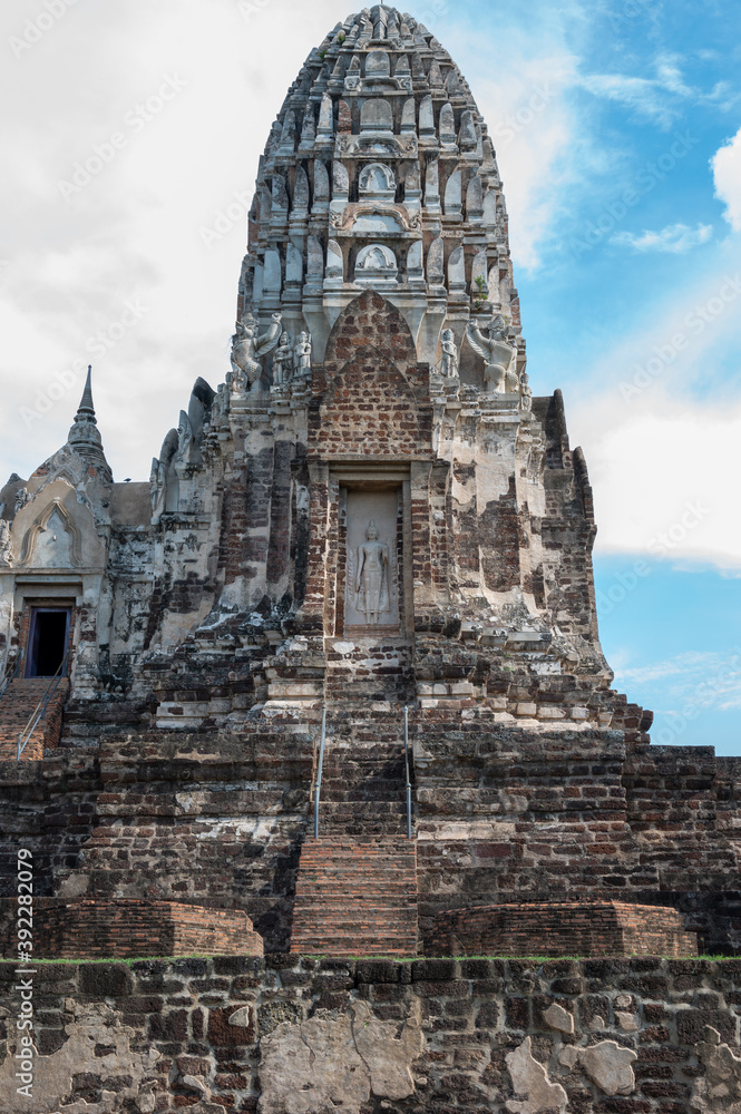 Ayutthaya / Thailand / August 8, 2020 : Wat Ratchaburana, Ancient Buddhist temple remains with elaborate carvings & a restored tower & tomb. Ayutthaya / Thailand / August 8, 2020 : Wat Ratchaburana, Ancient Buddhist temple remains with elaborate carvings & a restored tower & tomb.