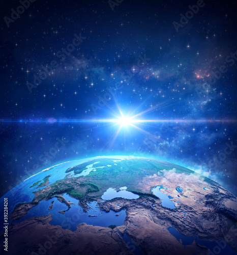 Surface of Planet Earth, space view of the World focused on Europe. The blue light of a comet shining into deep space. 3D illustration - Elements of this image furnished by NASA