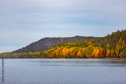 Clouds over the lake in the mountainous part of the tundra in autumn.