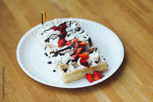 Belgium waffle with whip cream,chocholate and strawberry.