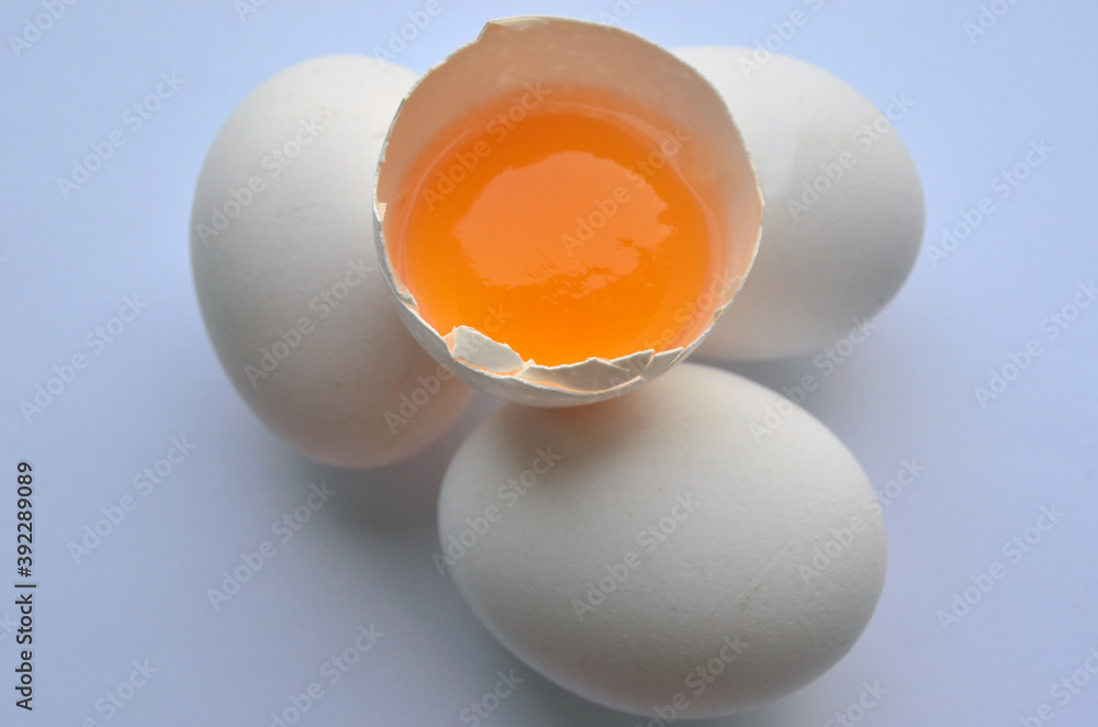 White chicken eggs on the table. orange yolk. Farm product, ingredients. Isolate. Easter. White chicken eggs on the table. orange yolk. Farm product, ingredients. Isolate. Easter.