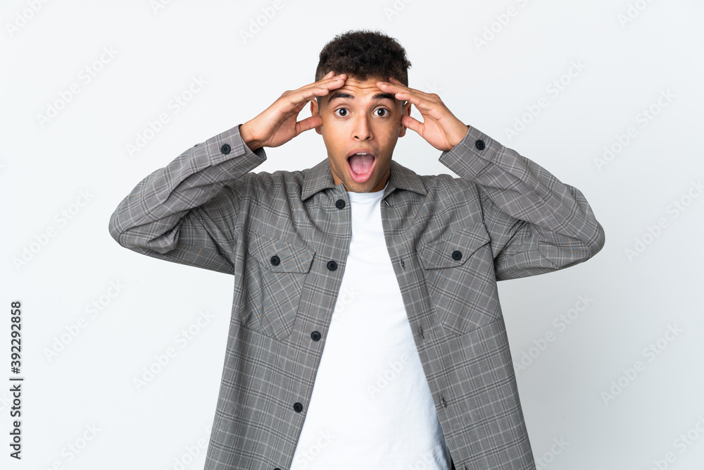 Young brazilian man isolated on white background with surprise expression Young brazilian man isolated on white background with surprise expression