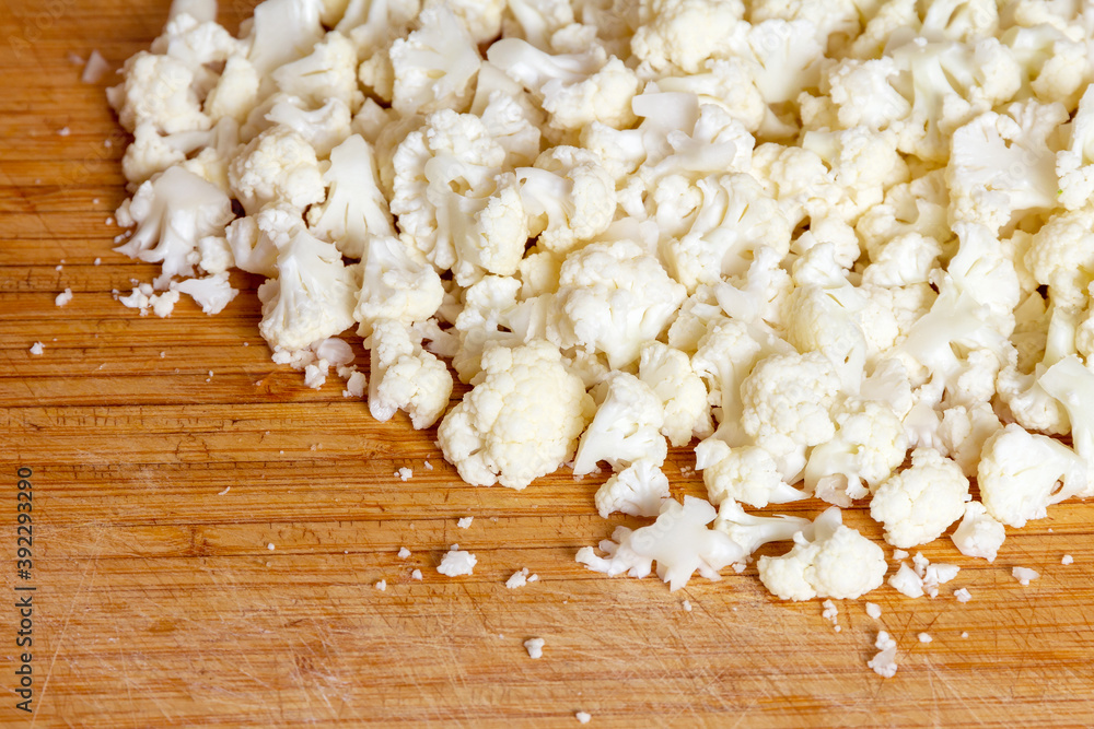 Cauliflower on a wooden cutting board Cauliflower on a wooden cutting board