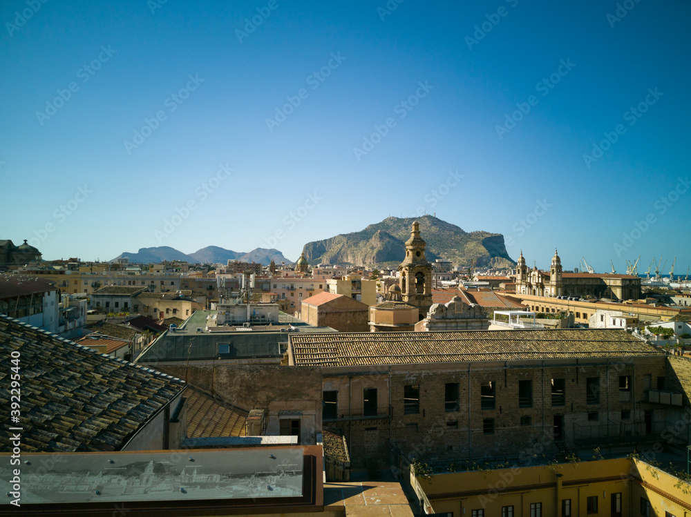 Obraz premium Urban landscape of Palermo the main city of Sicily in Italy. Here the roof and of the old houses with the mountains in the background seen from the St. Catherine's Monastery terraces