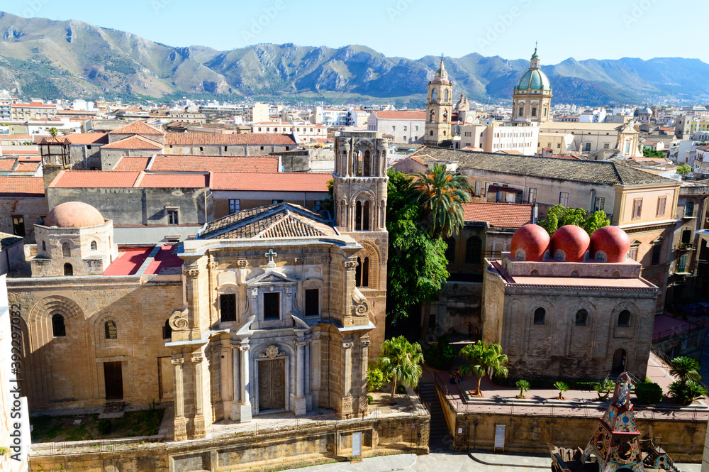 Fototapeta premium Urban landscape of Palermo the main city of Sicily in Italy. Here the roof and of the old houses with the mountains in the background seen from the St. Catherine's Monastery terraces