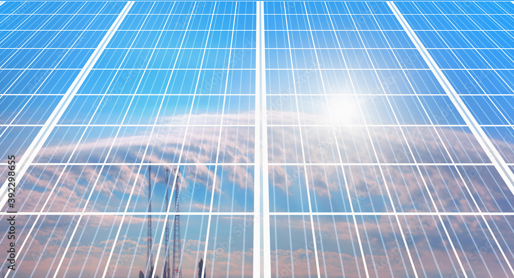 Solar Panel (Photovoltaic) with cloudy sky and sun reflection on panel Solar Panel (Photovoltaic) with cloudy sky and sun reflection on panel