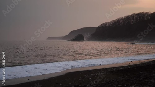 Seascape with beautiful rocks and waves. Glass beach, Vladivostok