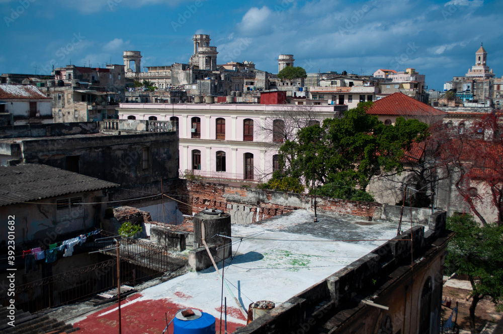 Aerial panoramic view of an old and destroyed city where there are houses and people live. Havana