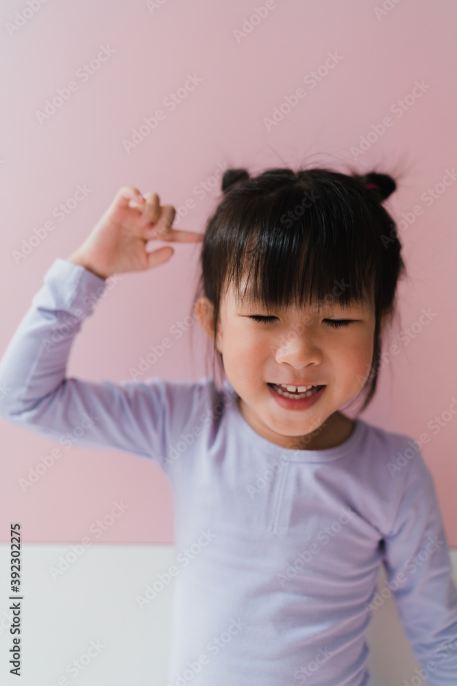 portrait of a Asian little girl with double-buns hair