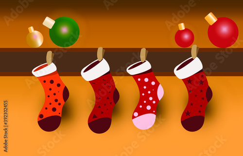 Colorful chrismas sock hank on wood wall with ball.